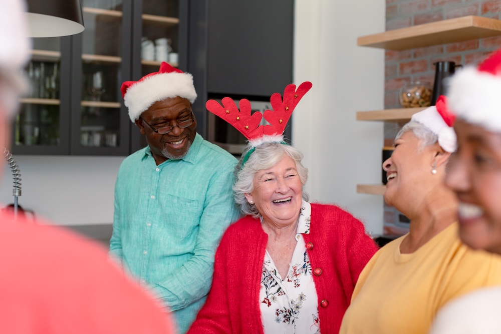 Group of seniors enjoying holiday party at a senior living communities near me