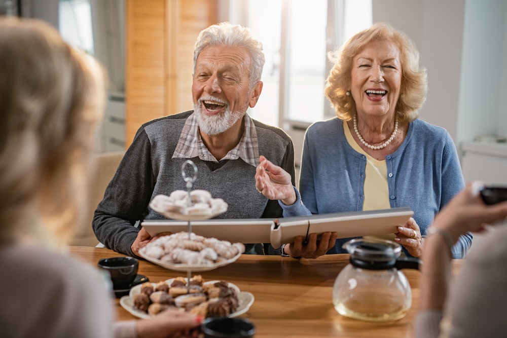 Senior couple laughing at senior living community
