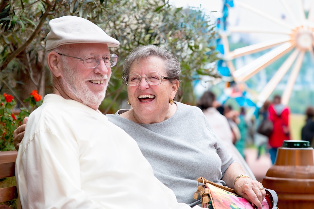 Happy couple outside enjoying their search of senior living communities dearborn mi